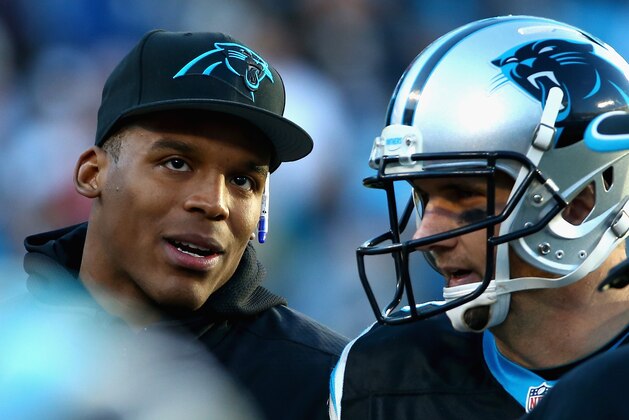 CHARLOTTE, NC - DECEMBER 14:   Cam Newton #1 speaks with  Derek Anderson #3 of the Carolina Panthers after their 19-17 victory over the Tampa Bay Buccaneers at Bank of America Stadium on December 14, 2014 in Charlotte, North Carolina.  (Photo by Streeter Lecka/Getty Images)