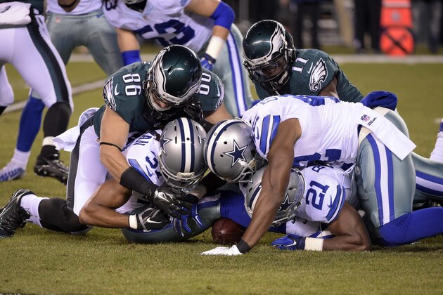 Dec 14, 2014; Philadelphia, PA, USA; Dallas Cowboys defensive back C.J. Spillman (37) recovers a fumble on the opening kickoff as running back Joseph Randle (21) and strong safety Barry Church (42) assist against Philadelphia Eagles tight end Zach Ertz (86) and wide receiver Josh Huff (11) in the first quarter at Lincoln Financial Field. Mandatory Credit: Eric Hartline-USA TODAY Sports