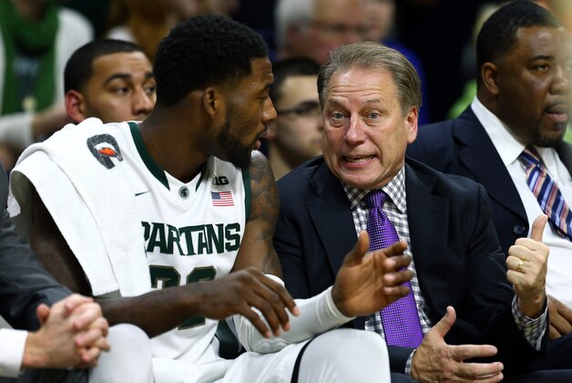 Dec 6, 2014; East Lansing, MI, USA;  Michigan State Spartans guard/forward Branden Dawson (22) and Michigan State Spartans head coach Tom Izzo talk on the bench against Arkansas-Pine Bluff Golden Lions during the 2nd half of a game at Jack Breslin Student Events Center. Mandatory Credit: Mike Carter-USA TODAY Sports