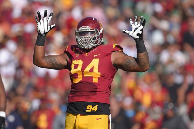 Southern California defensive end Leonard Williams gestures to fans during the first half an NCAA college football game against Notre Dame, Saturday, Nov. 29, 2014, in Los Angeles. Southern California won 49-14. (AP Photo/Mark J. Terrill)