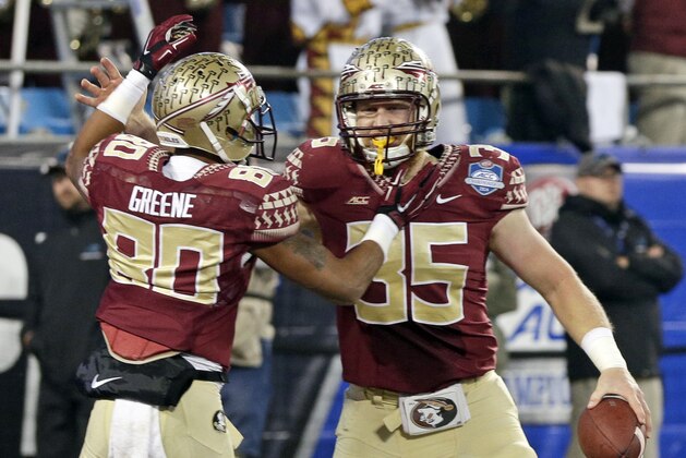 Florida State tight end Nick O'Leary (35) celebrates his touchdown against Georgia Tech with wide receiver Rashad Greene (80) during the first half of the Atlantic Coast Conference championship NCAA college football game in Charlotte, N.C., Saturday, Dec. 6, 2014. (AP Photo/Chuck Burton)