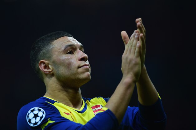 ISTANBUL, TURKEY - DECEMBER 09:  Alex Oxlade-Chamberlain of Arsenal applauds the crowd after victory in the UEFA Champions League Group D match between Galatasaray AS and Arsenal FC at Ali Sami Yen Arena on December 9, 2014 in Istanbul, Turkey.  (Photo by Jamie McDonald/Getty Images)