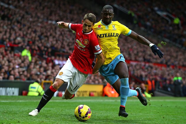 MANCHESTER, ENGLAND - NOVEMBER 08:  Adnan Januzaj of Manchester United competes with Yannick Bolasie of Crystal Palace during the Barclays Premier League match between Manchester United and Crystal Palace at Old Trafford on November 8, 2014 in Manchester, England.  (Photo by Clive Rose/Getty Images)