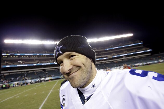 Dallas Cowboys' Tony Romo smiles as he walks off the field after an NFL football game against the Philadelphia Eagles, Sunday, Dec. 14, 2014, in Philadelphia. Dallas won 38-27. (AP Photo/Michael Perez)
