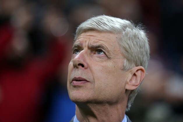 Arsenal's coach Arsene Wenger watches the game during their Champions League Group D soccer match with Galatasaray at the Turk Telekom Arena Stadium in Istanbul, Turkey, Tuesday, Dec. 9, 2014. (AP Photo)