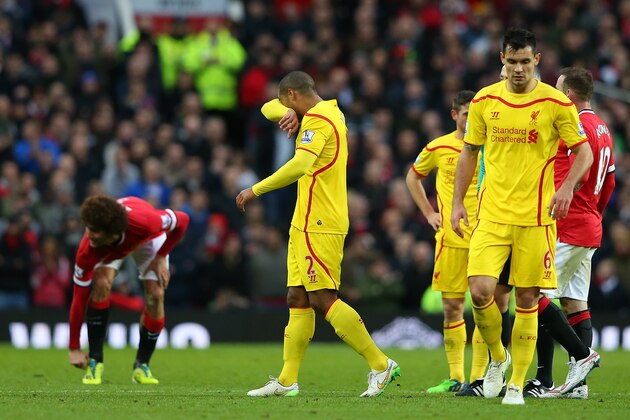 MANCHESTER, ENGLAND - DECEMBER 14:  Glen Johnson of Liverpool goes off after sustaining an injury during the Barclays Premier League match between Manchester United and Liverpool at Old Trafford on December 14, 2014 in Manchester, England.  (Photo by Alex Livesey/Getty Images)