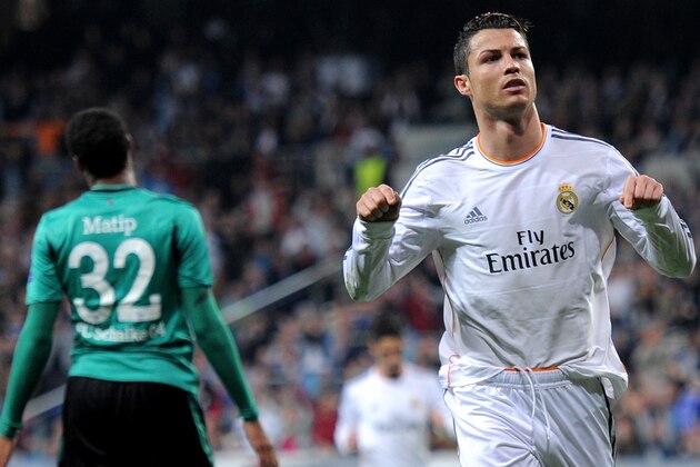 MADRID, SPAIN - MARCH 18:  Cristiano Ronaldo of Real Madrid celebrates after scoring his team's second goal during the UEFA Champions League Round of 16, second leg match between Real Madrid and FC Schalke 04 at Estadio Santiago Bernabeu on March 18, 2014 in Madrid, Spain.  (Photo by Denis Doyle/Getty Images)