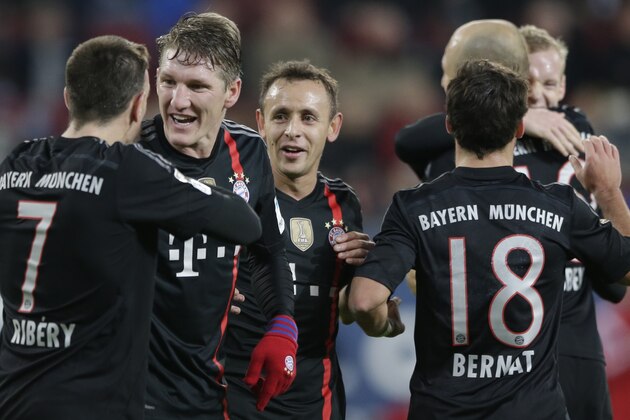 Bayern's Franck Ribery from France, from left, Bastian Schweinsteiger, Rafinha from Brazil, Arjen Robben from the Netherlands, Sebastian Rode and Juan Bernat from Spain celebrate after scoring during the German first division Bundesliga soccer match between FC Augsburg and FC Bayern Munich in the SGL Arena in Augsburg, Germany, on Saturday, Dec. 13, 2014. (AP Photo/Matthias Schrader)