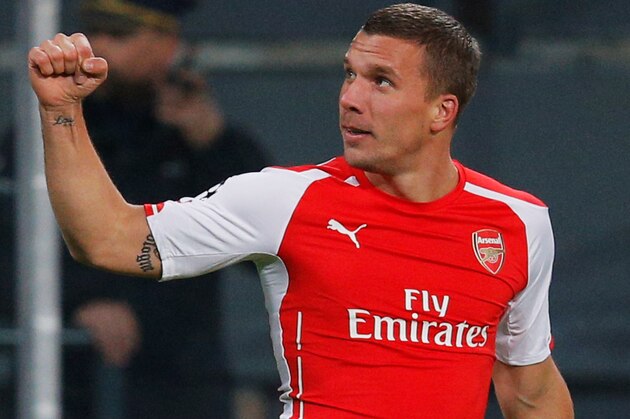 BRUSSELS, BELGIUM - OCTOBER 22:  Lukas Podolski of Arsenal (9) celebrates as he scores their second goal during the UEFA Champions League Group D match between RSC Anderlecht and Arsenal at Constant Vanden Stock Stadium on October 22, 2014 in Brussels, Belgium.  (Photo by Dean Mouhtaropoulos/Getty Images)