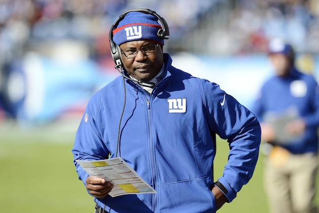 New York Giants defensive coordinator Perry Fewell walks the sideline in the first half of an NFL football game between the Giants and the Tennessee Titans Sunday, Dec. 7, 2014, in Nashville, Tenn. (AP Photo/Mark Zaleski)