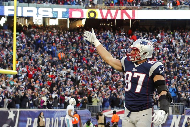 Dec 14, 2014; Foxborough, MA, USA; New England Patriots tight end Rob Gronkowski (87) signals for a first down to the crowd during the second half against the Miami Dolphins at Gillette Stadium. The Patriots won 41-13. Mandatory Credit: Winslow Townson-USA TODAY Sports