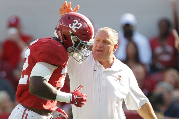 Sep 20, 2014; Tuscaloosa, AL, USA; Alabama Crimson Tide director of football operations Joe Pannunzio congratulates Alabama Crimson Tide linebacker Rashaan Evans (32) during the game against the Florida Gators at Bryant-Denny Stadium. Mandatory Credit: Marvin Gentry-USA TODAY Sports