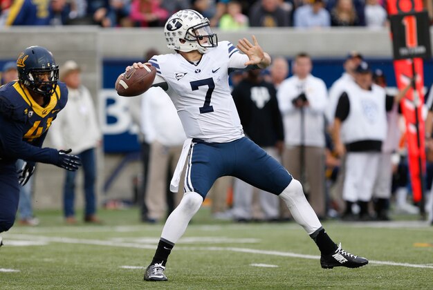 Nov 29, 2014; Berkeley, CA, USA; Brigham Young Cougars quarterback Christian Stewart (7) throws the ball against the California Golden Bears during the first quarter at Memorial Stadium. Mandatory Credit: Kelley L Cox-USA TODAY Sports