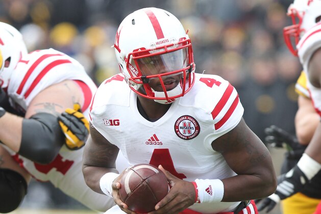 Nov 28, 2014; Iowa City, IA, USA; Nebraska Cornhuskers quarterback Tommy Armstrong Jr. (4) looks to hand off against the Iowa Hawkeyes at Kinnick Stadium. Mandatory Credit: Reese Strickland-USA TODAY Sports
