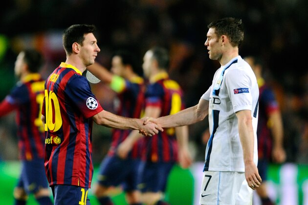 BARCELONA, SPAIN - MARCH 12:  Lionel Messi of Barcelona shakes hands with a dejected James Milner of Manchester City following his team's 2-1 victory during the UEFA Champions League Round of 16, second leg match between FC Barcelona and Manchester City  at Camp Nou on March 12, 2014 in Barcelona, Spain.  (Photo by David Ramos/Getty Images)