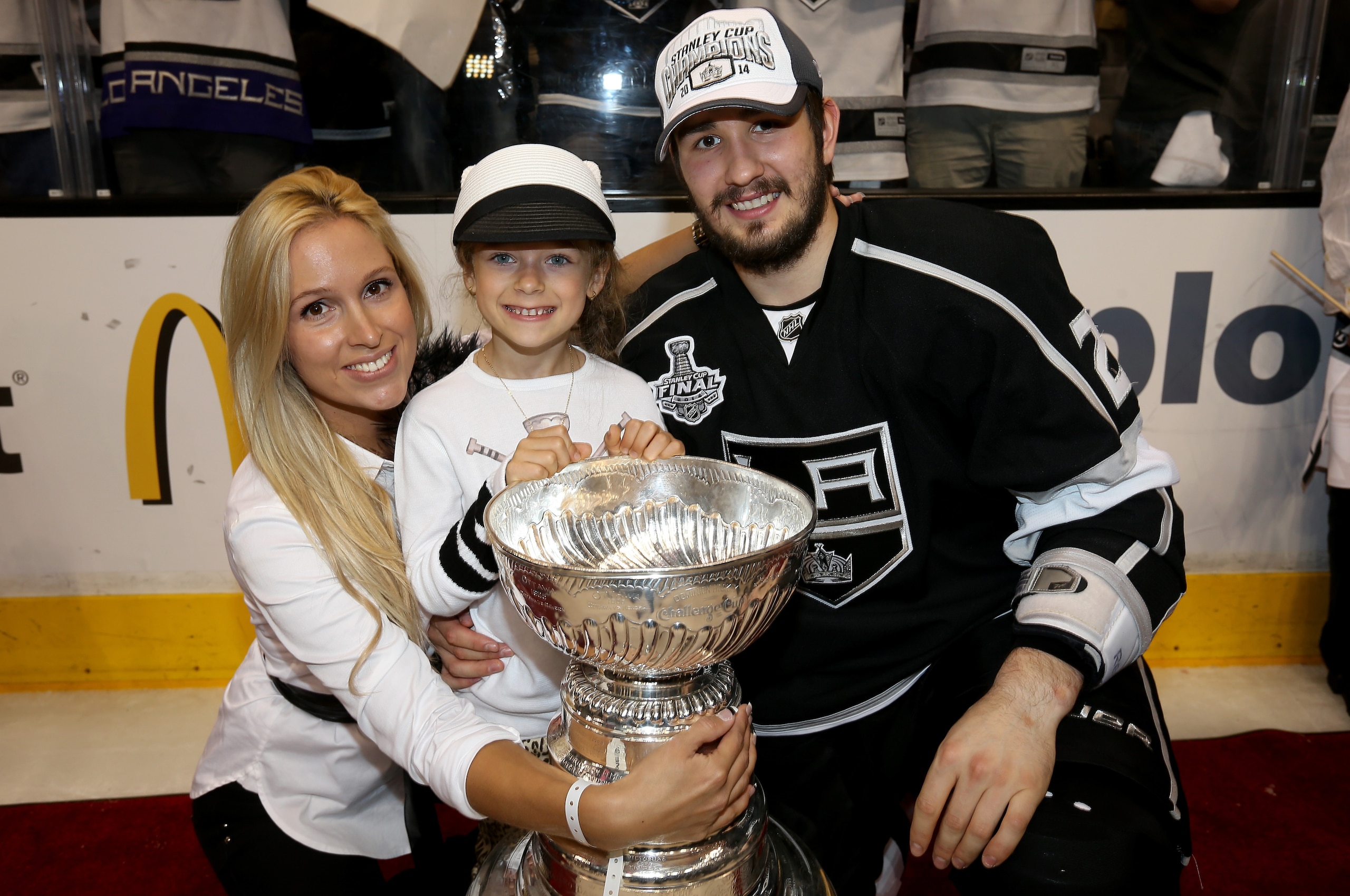 LOS ANGELES, CA - JUNE 13:  Slava Voynov #26 of the Los Angeles Kings and family celebrate after the Kings win the Stanley Cup after defeating the Rangers 3-2 in double overtime during Game Five of the 2014 Stanley Cup Final at Staples Center on June 13, 2014 in Los Angeles, California.  (Photo by Bruce Bennett/Getty Images)