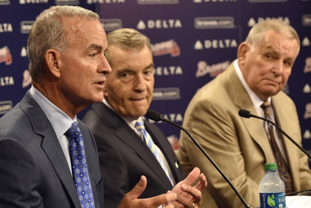 The Atlanta Braves announce interim general manager John Hart, left, at a news conference with team president John Schuerholz and former manager Bobby Cox, right, after the baseball team fired general manager Frank Wren Monday, Sept. 22, 2014, in Atlanta. (AP Photo/David Tulis)