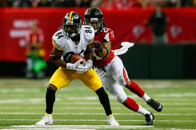 ATLANTA, GA - DECEMBER 14: Antonio Brown #84 of the Pittsburgh Steelers is tackled by Dwight Lowery #20 of the Atlanta Falcons after a catch in the second half at the Georgia Dome on December 14, 2014 in Atlanta, Georgia.  (Photo by Kevin C. Cox/Getty Images)