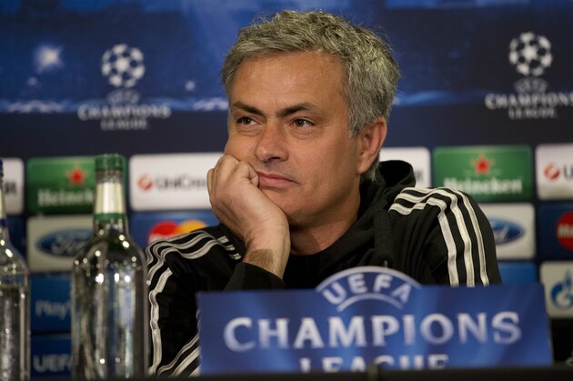Chelsea head coach Jose Mourinho holds his hands to his face during a press conference at their Stamford Bridge stadium in London, Monday, April 7, 2014.  Paris Saint-Germain take a 3-1 lead from the first leg into their second leg Champions League quarterfinal soccer match against Chelsea on Tuesday.  (AP Photo/Matt Dunham)