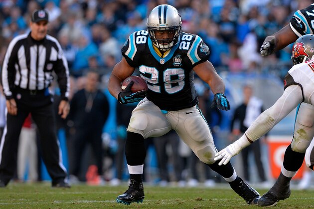 CHARLOTTE, NC - DECEMBER 14:  Jonathan Stewart #28 of the Carolina Panthers runs the ball against the Tampa Bay Buccaneers in the 2nd half during their game at Bank of America Stadium on December 14, 2014 in Charlotte, North Carolina.  (Photo by Grant Halverson/Getty Images)