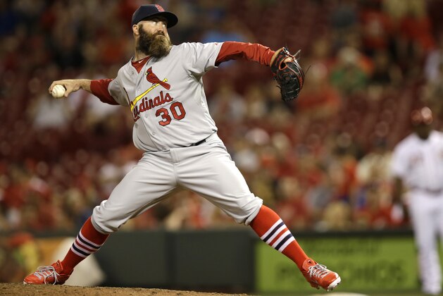 St. Louis Cardinals relief pitcher Jason Motte throws against the Cincinnati Reds in a baseball game, Saturday, May 24, 2014, in Cincinnati. (AP Photo/Al Behrman)