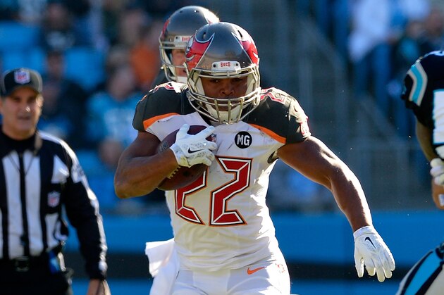 CHARLOTTE, NC - DECEMBER 14:  Doug Martin #22 of the Tampa Bay Buccaneers runs the ball against the Carolina Panthers in the 2nd half during their game at Bank of America Stadium on December 14, 2014 in Charlotte, North Carolina.  (Photo by Grant Halverson/Getty Images)