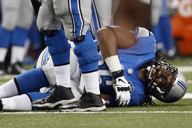 Detroit Lions tackle LaAdrian Waddle (66) is injured against the Minnesota Vikings during an NFL football game in Detroit Sunday, Dec. 14, 2014. (AP Photo/Paul Sancya)