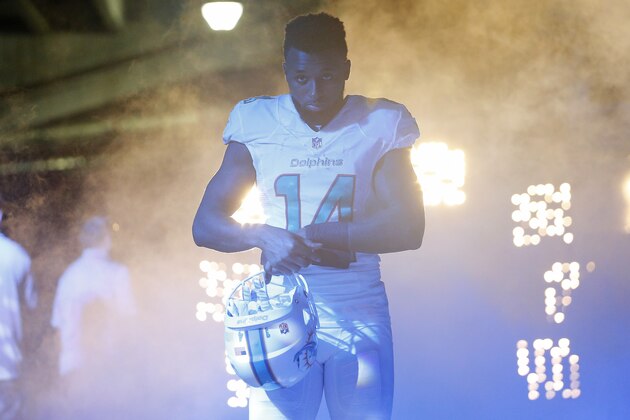 MIAMI GARDENS, FL - DECEMBER 07:  Wide receiver Jarvis Landry #14 of the Miami Dolphins heads towards the field before the start of play against the Baltimore Ravens during a game at Sun Life Stadium on December 7, 2014 in Miami Gardens, Florida.  (Photo by Chris Trotman/Getty Images)