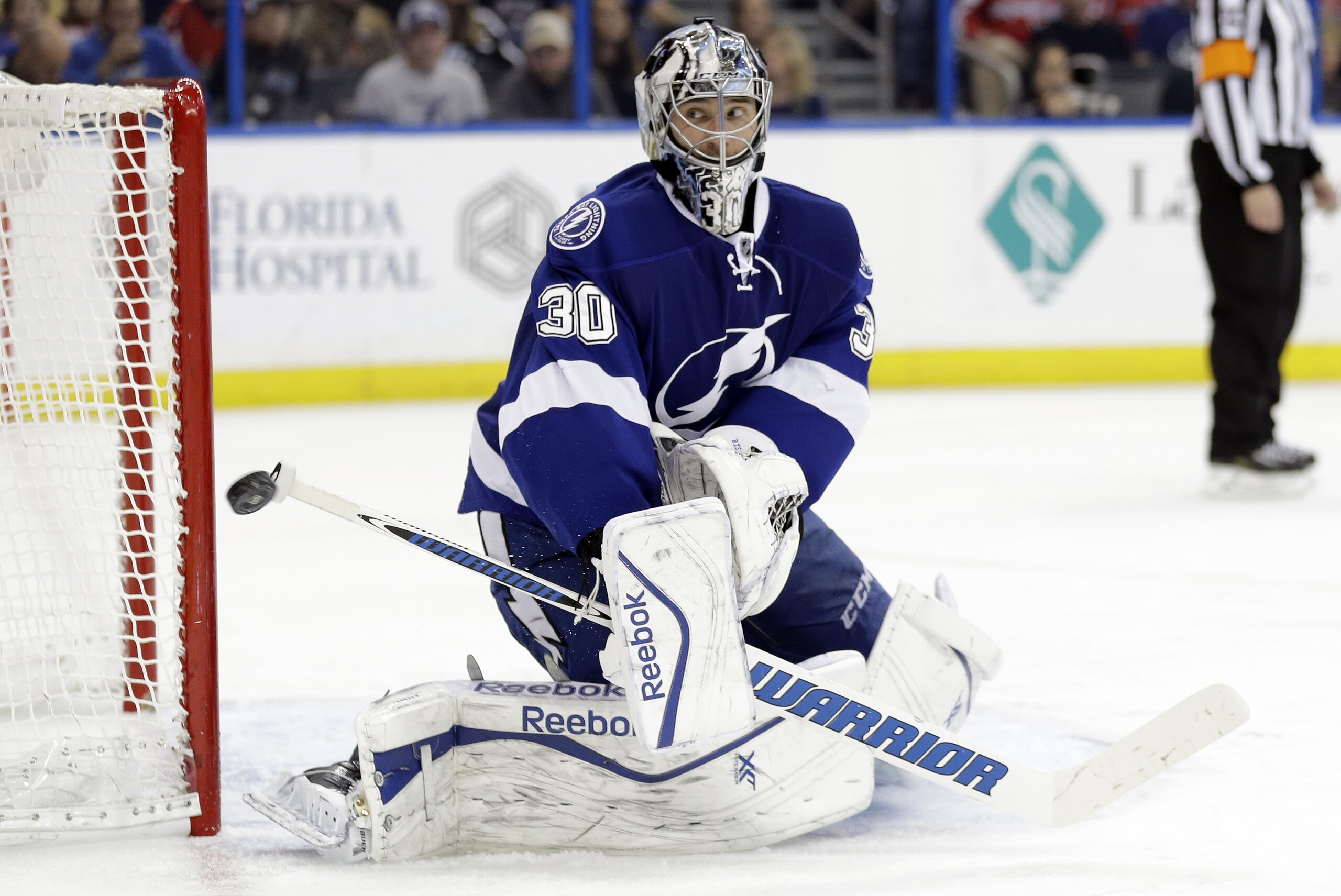 Tampa Bay Lightning goalie Ben Bishop (30) makes a save on a shot by the Washington Capitals during the third period of an NHL hockey game Tuesday, Dec. 9, 2014, in Tampa, Fla. (AP Photo/Chris O'Meara)