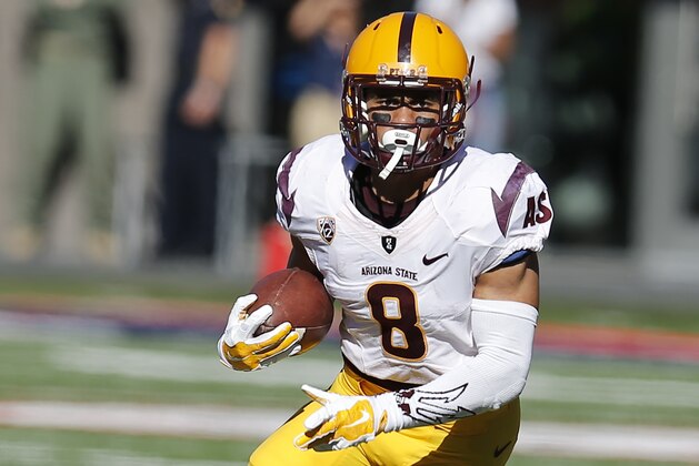 Arizona State running back D.J. Foster (8) during the second half of an NCAA college football game against Arizona, Friday, Nov. 28, 2014, in Tucson, Ariz. (AP Photo/Rick Scuteri)