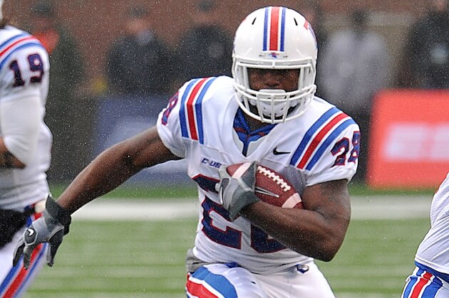 Louisiana Tech Kenneth Dixon (28) runs the ball  during the CUSA Championship game with Marshall University in Huntington, W.Va., Saturday Dec. 6, 2014. (AP Photo/Chris Tilley)