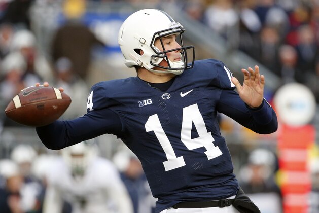 Penn State quarterback Christian Hackenberg (14) throws a pass during the second half of an NCAA college football game against Michigan State in State College, Pa., Saturday, Nov. 29, 2014. Michigan State  won 34-10. (AP Photo/Gene J. Puskar)
