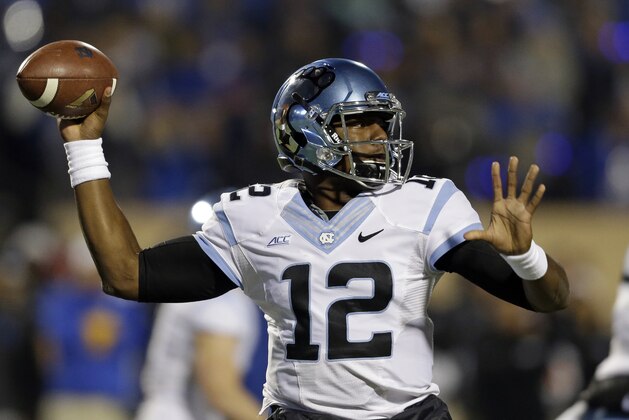 North Carolina quarterback Marquise Williams (12) passes during the first half of an NCAA college football game against Duke in Durham, N.C., Thursday, Nov. 20, 2014. (AP Photo/Gerry Broome)