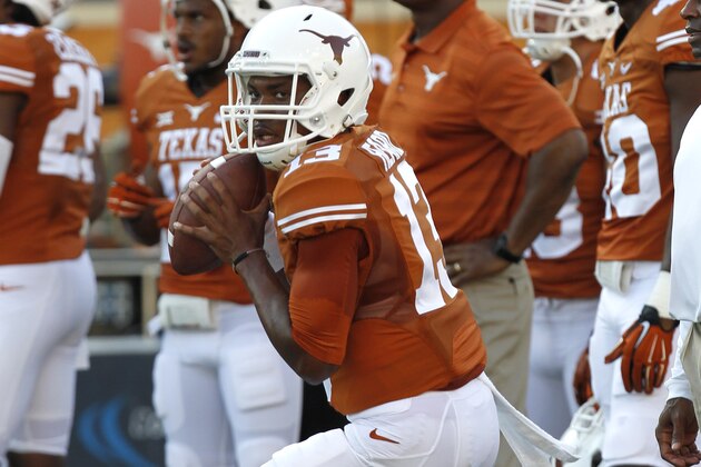 AUSTIN, TX - SEPTEMBER 6: Jerrod Heard #13 of the Texas Longhorns passes during pregame warmups before playing the BYU Cougars on September 6, 2014 at Darrell K Royal-Texas Memorial Stadium in Austin, Texas. (Photo by Chris Covatta/Getty Images)