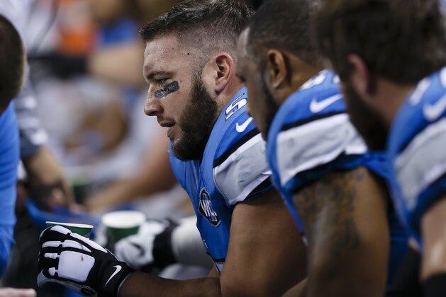Detroit Lions center Dominic Raiola (51) on the sideline against the Minnesota Vikings during an NFL football game at Ford Field in Detroit, Sunday, Dec. 14, 2014. (AP Photo/Rick Osentoski)