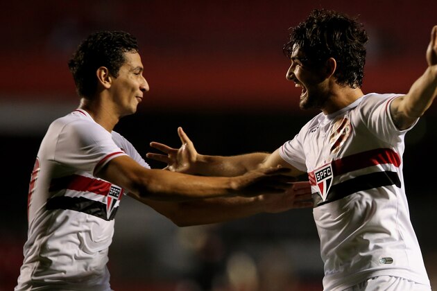 SAO PAULO, BRAZIL - AUGUST 10:  Pato (R) of Sao Paulo celebrates scoring the third goal with Paulo Henrique Ganso (L) during the match between Sao Paulo and Vitoria for the Brazilian Series A 2014 at Estadio do Morumbi on August 10, 2014 in Sao Paulo, Brazil.  (Photo by Friedemann Vogel/Getty Images)