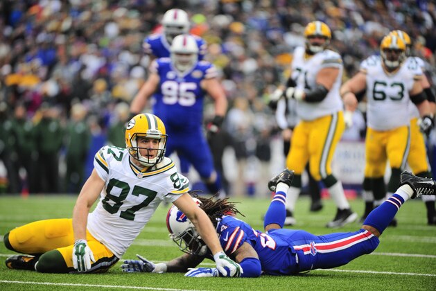 Green Bay Packers wide receiver Jordy Nelson (87) and Buffalo Bills' Stephon Gilmore (24) react after a play during the first half of an NFL football game Sunday, Dec. 14, 2014, in Orchard Park, N.Y. (AP Photo/Gary Wiepert)
