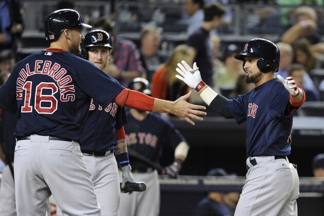 Boston Red Sox batter Shane Victorino, right, celebrates with Will Middlebrooks after Victorino hit a two-run home run during the eighth inning of a baseball game against the New York Yankees, Friday, Sept. 6, 2013, at Yankee Stadium in New York. (AP Photo/Bill Kostroun)