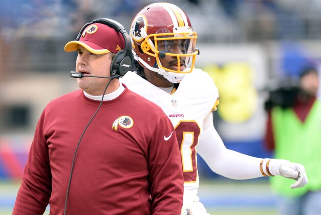 Dec 14, 2014; East Rutherford, NJ, USA; Washington Redskins head coach Jay Gruden and Washington Redskins quarterback Robert Griffin III (10) during the game against the New York Giants at MetLife Stadium. Mandatory Credit: Robert Deutsch-USA TODAY Sports