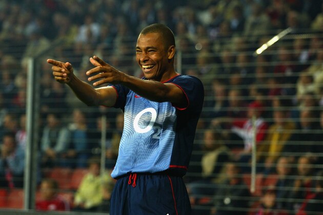 EINDHOVEN - SEPTEMBER 25:  Gilberto Silva of Arsenal celebrates scoring the first goal during Champions League First Phase Group A match between PSV Eindhoven and Arsenal at The Philips Stadium in Eindhoven, Netherlands on September 25, 2002. (Photo By Ben Radford/Getty Images)