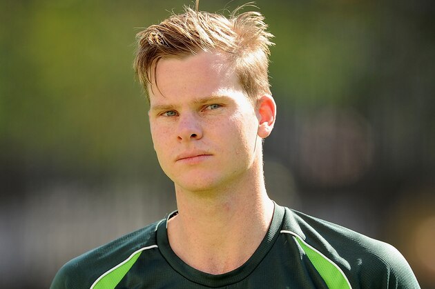 BRISBANE, AUSTRALIA - DECEMBER 15:  Steve Smith looks on during an Australian training session at The Gabba on December 15, 2014 in Brisbane, Australia.  (Photo by Matt Roberts/Getty Images)