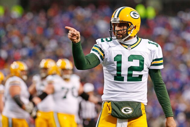 Dec 14, 2014; Orchard Park, NY, USA; Green Bay Packers quarterback Aaron Rodgers (12) gestures during the game against the Buffalo Bills at Ralph Wilson Stadium. The Bills beat the Packers 21-13. Mandatory Credit: Kevin Hoffman-USA TODAY Sports