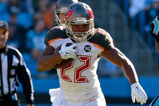 CHARLOTTE, NC - DECEMBER 14:  Doug Martin #22 of the Tampa Bay Buccaneers runs the ball against the Carolina Panthers in the 2nd half during their game at Bank of America Stadium on December 14, 2014 in Charlotte, North Carolina.  (Photo by Grant Halverson/Getty Images)