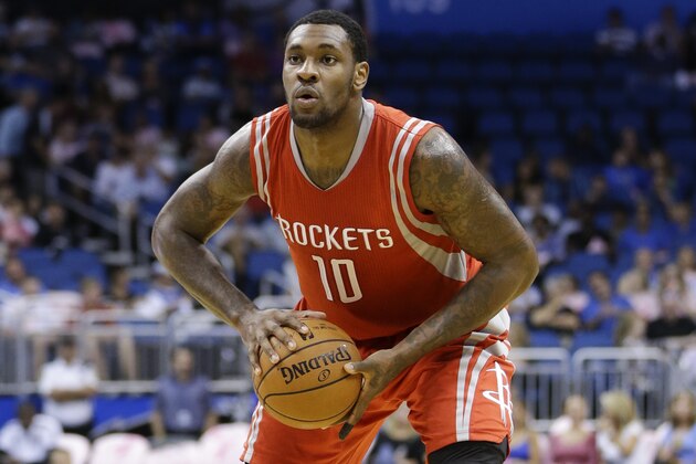 Houston Rockets' Tarik Black (10) looks to pass the ball against the Orlando Magic during the first half of an NBA preseason basketball game in Orlando, Fla., Wednesday, Oct. 22, 2014. (AP Photo/John Raoux)