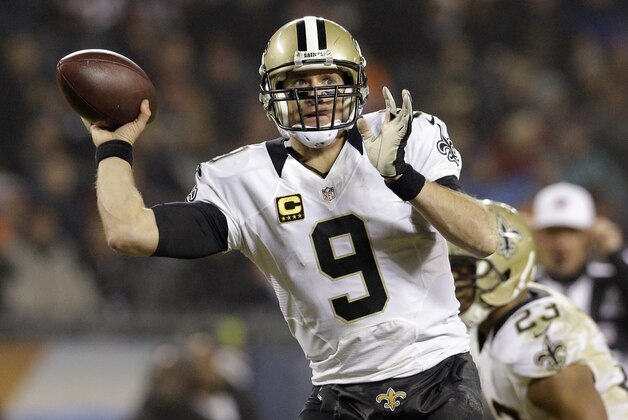 New Orleans Saints quarterback Drew Brees (9) throws a pass during the second half of an NFL football game against the Chicago Bears Monday, Dec. 15, 2014, in Chicago. (AP Photo/Nam Y. Huh)