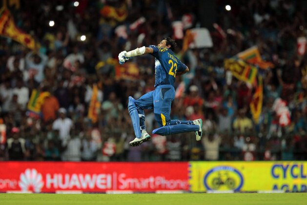 Sri Lankan batsman Tillakaratne Dilshan celebrates scoring a century during the seventh one day international cricket match between England and Sri Lanka in Colombo, Sri Lanka,Tuesday, Dec. 16, 2014. (AP Photo/Eranga Jayawardena)