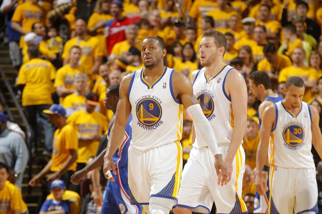 OAKLAND, CA - APRIL 27: Andre Iguodala #9 and David Lee #10 are shown walking to the huddle during a timeout against the Los Angeles Clippers in Game Four of the Western Conference Quarterfinals during the 2014 NBA Playoffs at Oracle Arena on April 27, 2014 in Oakland, California. NOTE TO USER: User expressly acknowledges and agrees that, by downloading and/or using this Photograph, user is consenting to the terms and conditions of Getty Images License Agreement. Mandatory Copyright Notice: Copyright 2014 NBAE (Photo by Rocky Widner/NBAE via Getty Images)