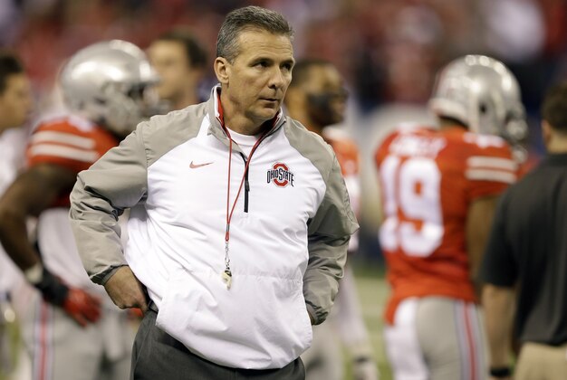 Ohio State head coach Urban Meyer roams the field before the start of the Big Ten Conference championship NCAA college football game between Ohio State and Wisconsin Saturday, Dec. 6, 2014, in Indianapolis. (AP Photo/Darron Cummings)