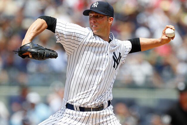 NEW YORK, NY - JULY 26: Chris Capuano #26 of the New York Yankees delivers a pitch against the Toronto Blue Jays during the third inning against the New York Yankees during a MLB baseball game at Yankee Stadium on July 26, 2014 in the Bronx borough of New York City. (Photo by Rich Schultz/Getty Images)