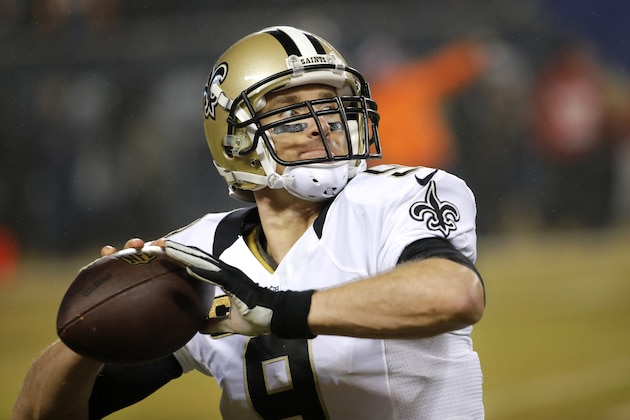 New Orleans Saints quarterback Drew Brees warms up before an NFL football game against the Chicago Bears Monday, Dec. 15, 2014, in Chicago. (AP Photo/Charles Rex Arbogast)